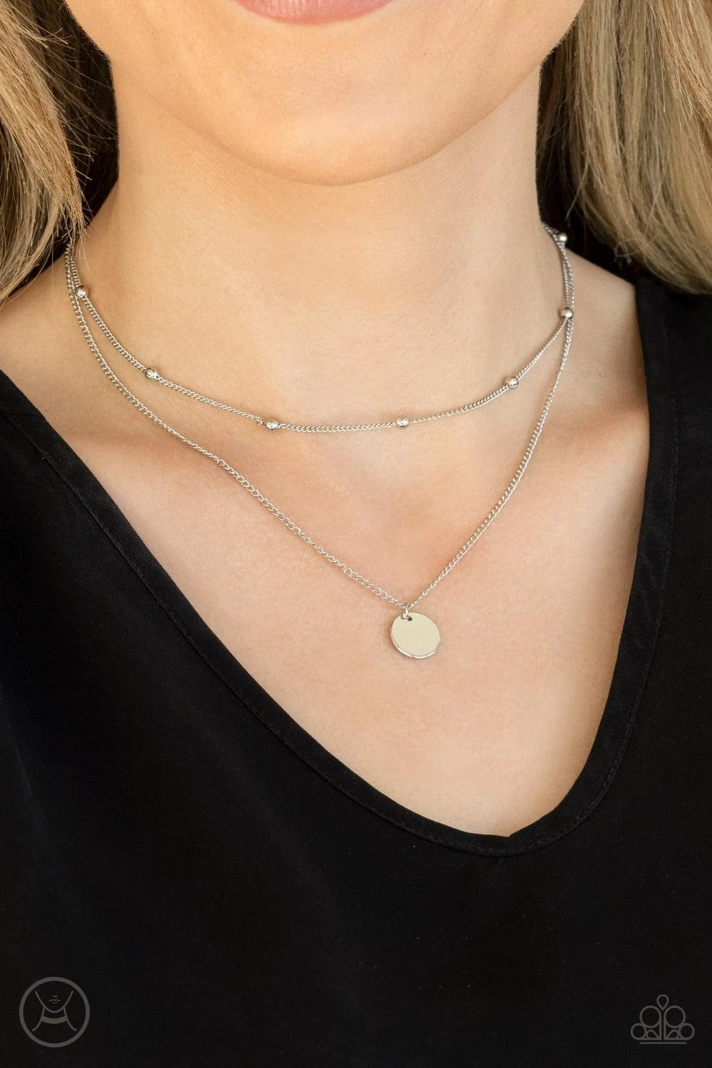 Paparazzi Accessories Modestly Minimalist - Silver Infused with a silver beaded chain, a dainty silver disc slides along a classic silver chain around the neck, creating sleek layers. Features an adjustable clasp closure. Sold as one individual choker nec