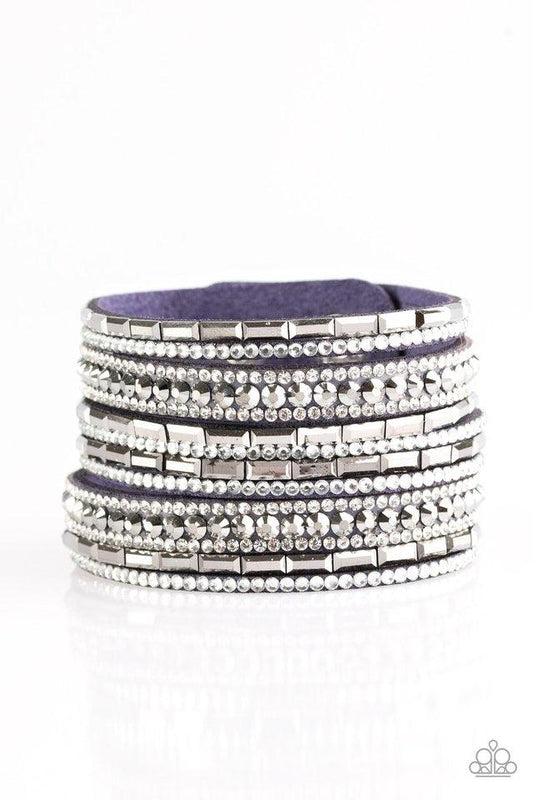 Paparazzi Accessories Wham Bam Glam - Blue Varying in size and shape, glassy white and smoky hematite rhinestones are encrusted along strands of blue suede for a sassy look. Features an adjustable snap closure. Jewelry
