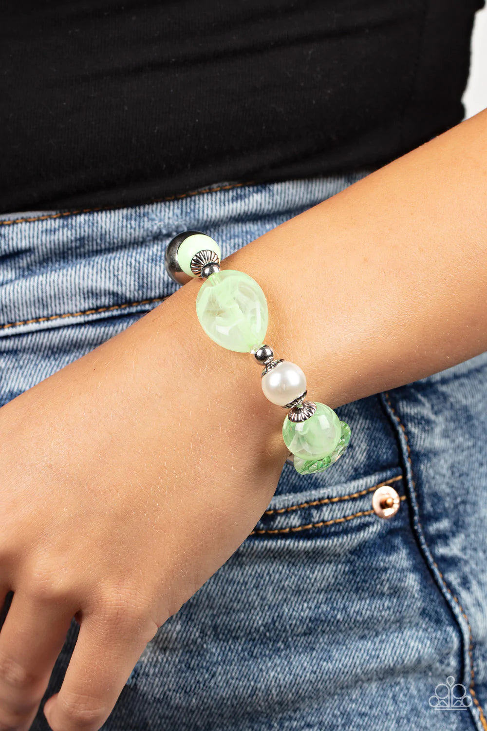 Paparazzi Accessories Resort Ritz - Green A lavish assortment of white pearls, silver accents, and glassy and acrylic Green Ash beads are threaded along a stretchy band around the wrist for a refreshing pop of color. Sold as one individual bracelet. Jewel