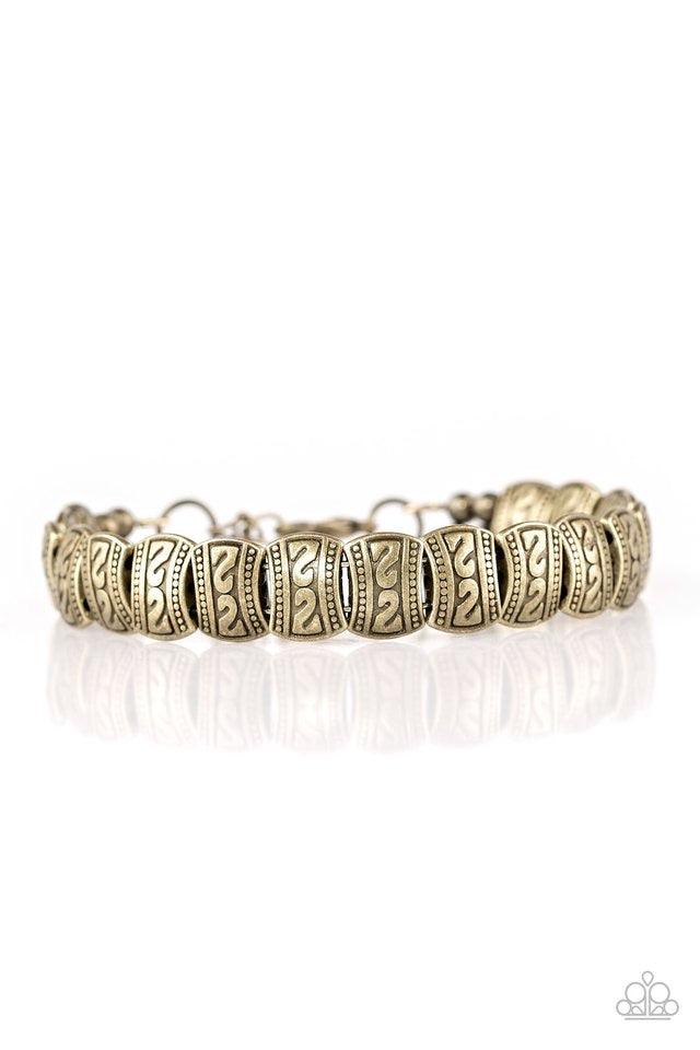 Paparazzi Accessories Montezuma Mountains - Brass Embossed in tribal inspired patterns, dainty brass frames are threaded along a brass wire and wrapped around the wrist for a seasonal look. Features an adjustable clasp closure. Sold as one individual brac