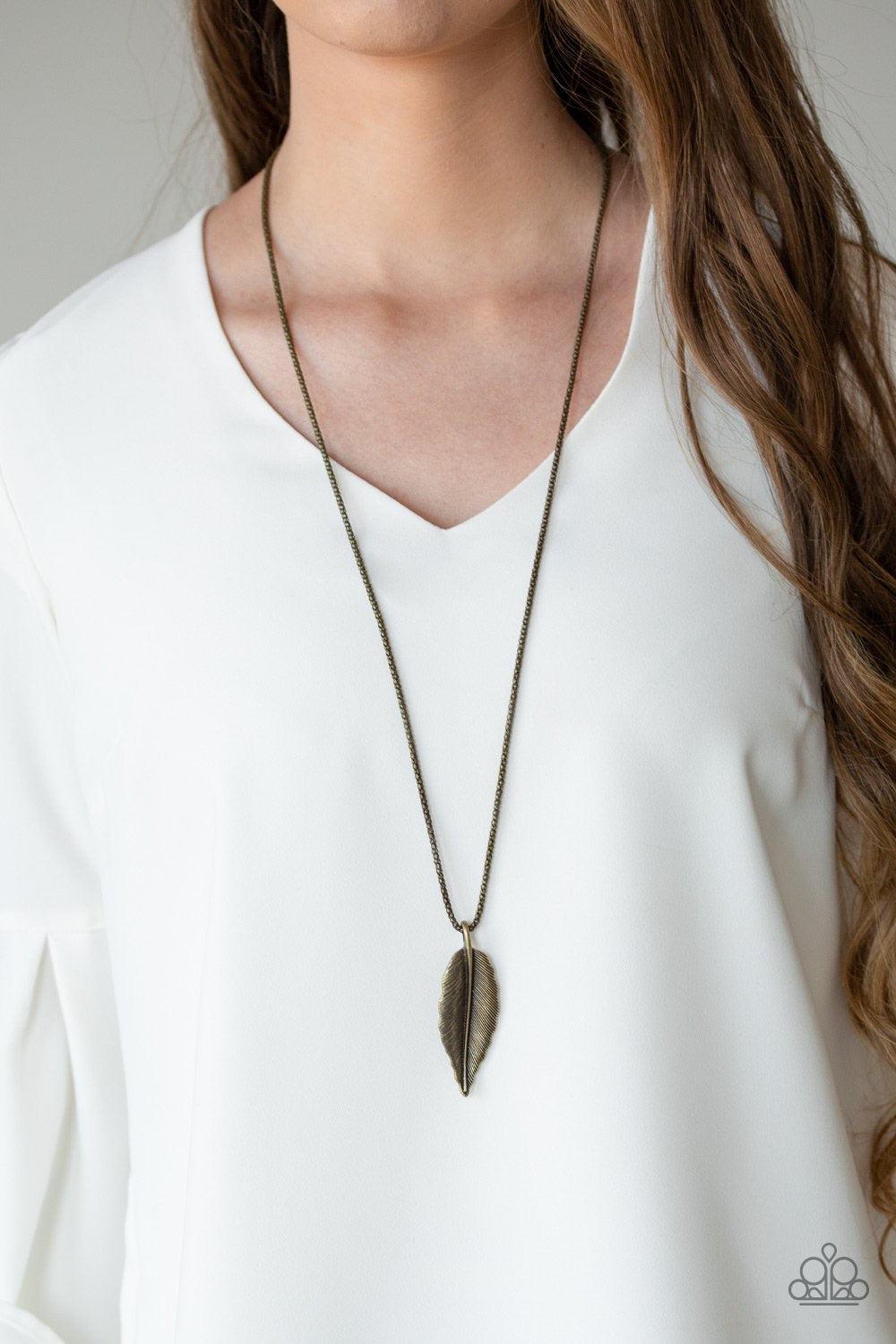 Paparazzi Accessories Feather Forager - Brass Featuring lifelike textures, a glistening brass feather pendant swings from the bottom of a lengthened brass popcorn chain for a seasonal look. Features an adjustable clasp closure. Jewelry