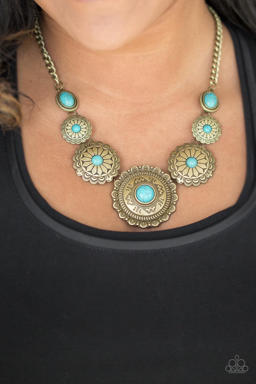 Paparazzi Accessories Mayan Marvel - Brass Radiating with tribal inspired textures, round brass frames link below the collar in a seasonal fashion. Refreshing turquoise stones are pressed into the ornate centers for a seasonal finish. Features an adjustab