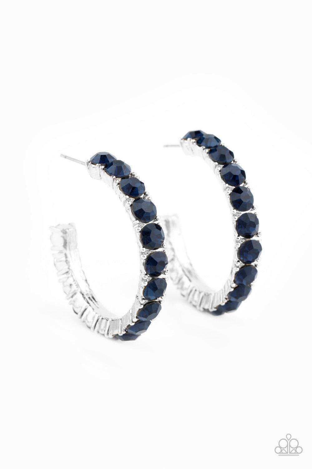 Paparazzi Accessories Classy Is In Session - Blue An oversized collection of glittery blue rhinestones are encrusted along a textured silver hoop, creating a glamorous sparkle. Earring attaches to a standard post fitting. Hoop measures approximately 1 1/2