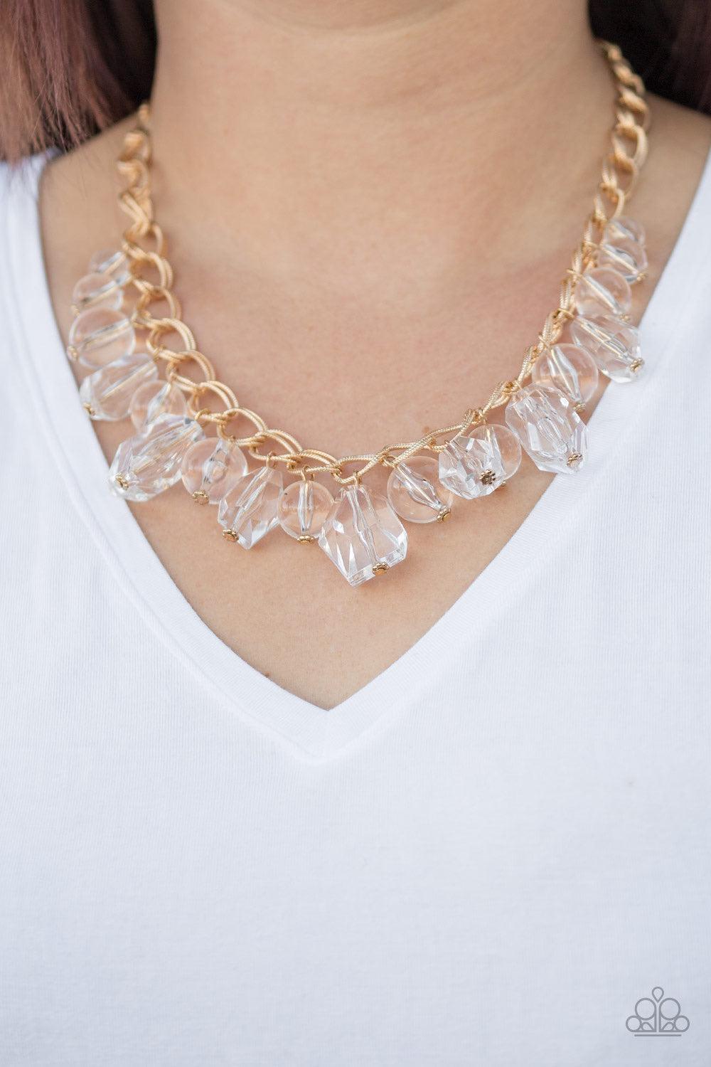 Paparazzi Accessories Gorgeously Globetrotter - Gold Varying in shape and shimmer, smooth and faceted glassy beads trickle from doubled gold chain links, creating a glamorous fringe below the collar. Features an adjustable clasp closure. Sold as one indiv