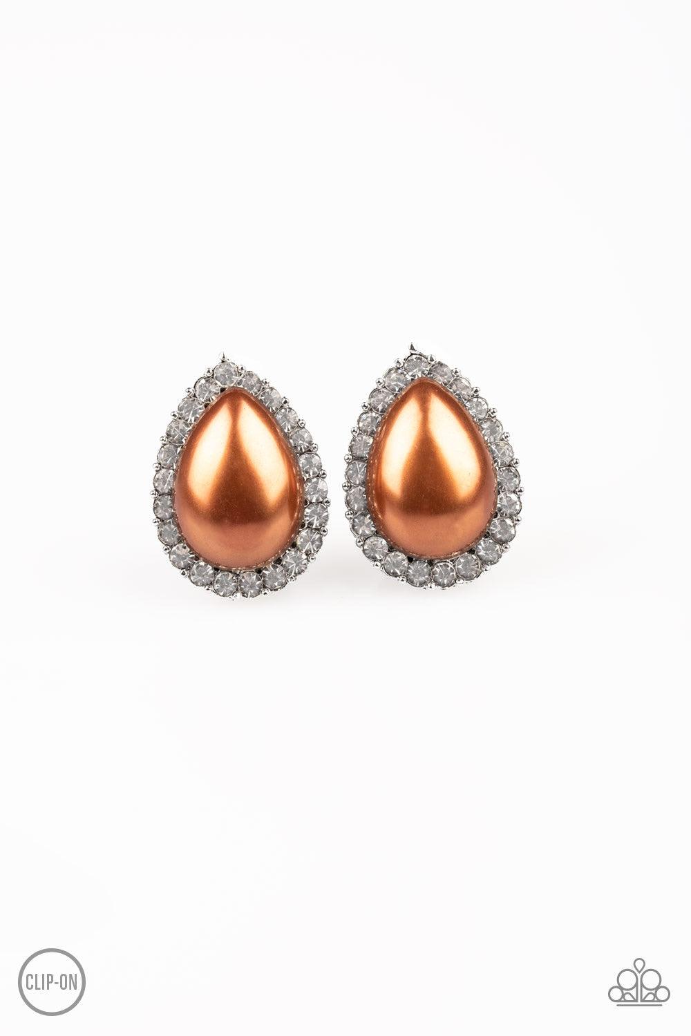 Paparazzi Accessories Old Hollywood Opulence - Brown *Clip-On A ring of glassy white rhinestones spins around a pearly brown teardrop bead center, creating a timeless frame. Earring attaches to a standard clip-on earring. Jewelry