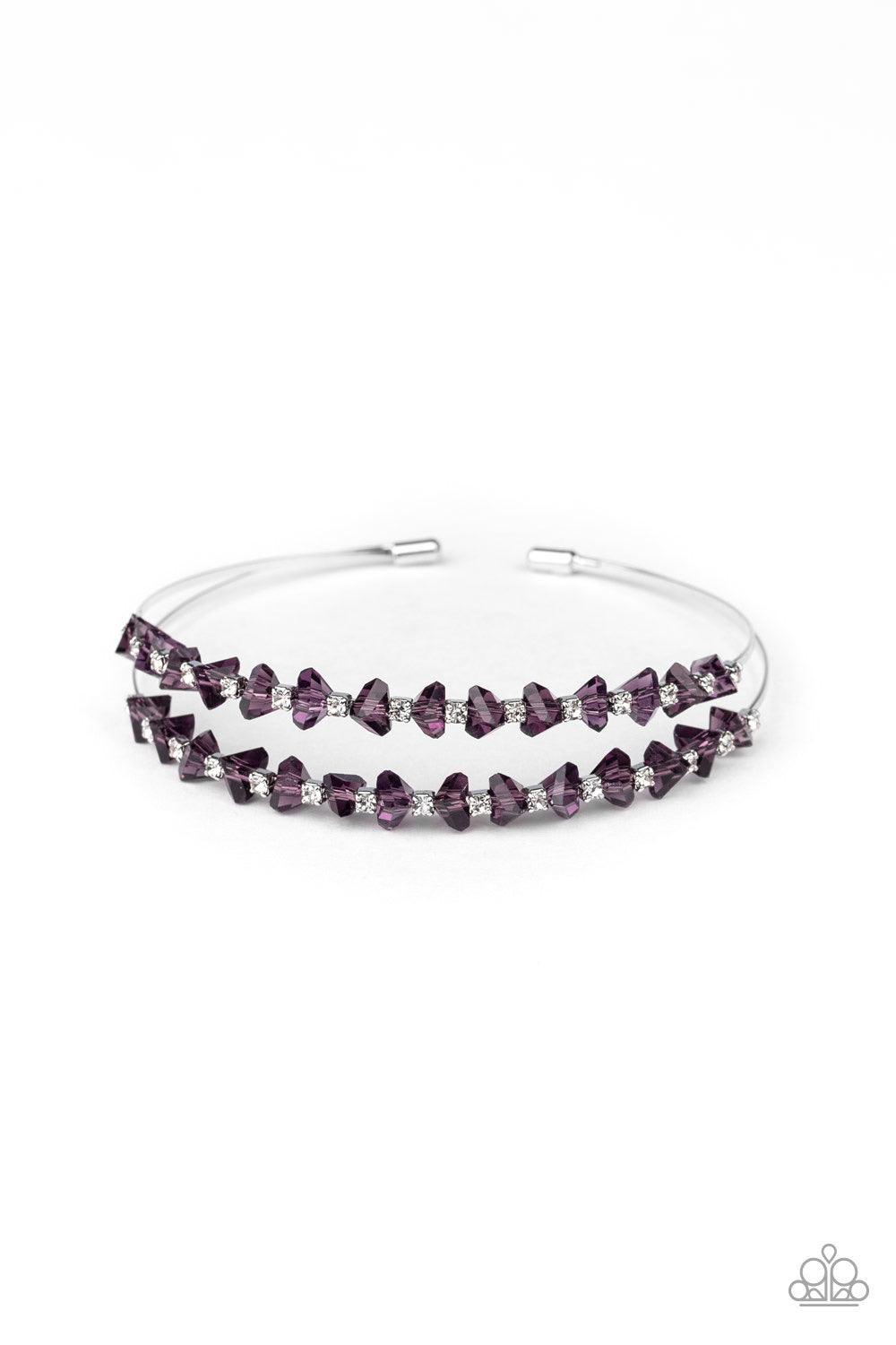 Paparazzi Accessories Prismatic Posh - Purple Featuring jagged cuts, a collection of faceted purple crystal-like beads and dainty white rhinestones are encrusted along the tops of two silver wires, coalescing into a glamorous cuff. Jewelry