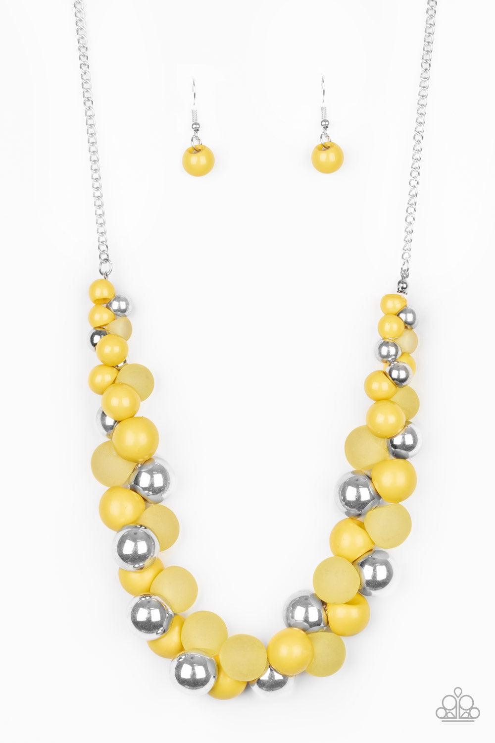Paparazzi Accessories Bubbly Brilliance - Yellow A bubbly collection of imperfect silver, opaque, and yellow beads are threaded along an invisible wire below the collar, creating a colorful cluster. Features an adjustable clasp closure. Jewelry