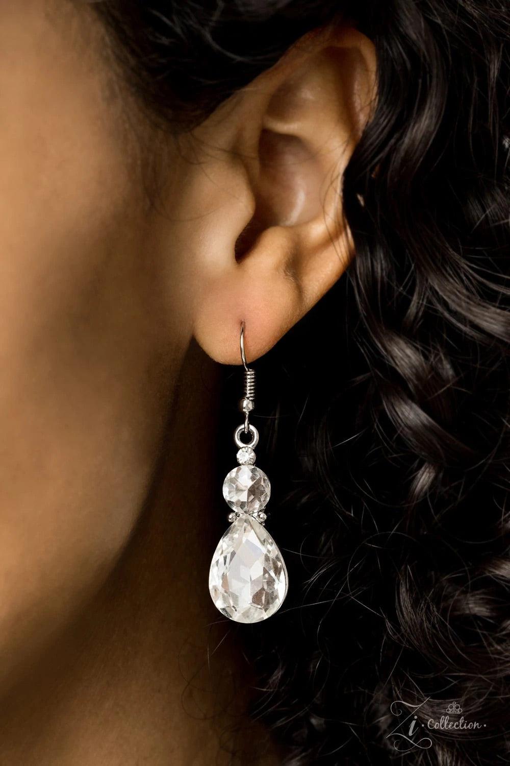 Paparazzi Accessories Reign Dramatic frames featuring tranquil teardrop and classic round white rhinestones delicately link below the collar for a showstopping look. A large teardrop rhinestone drips from the center, creating an unapologetic pendant that