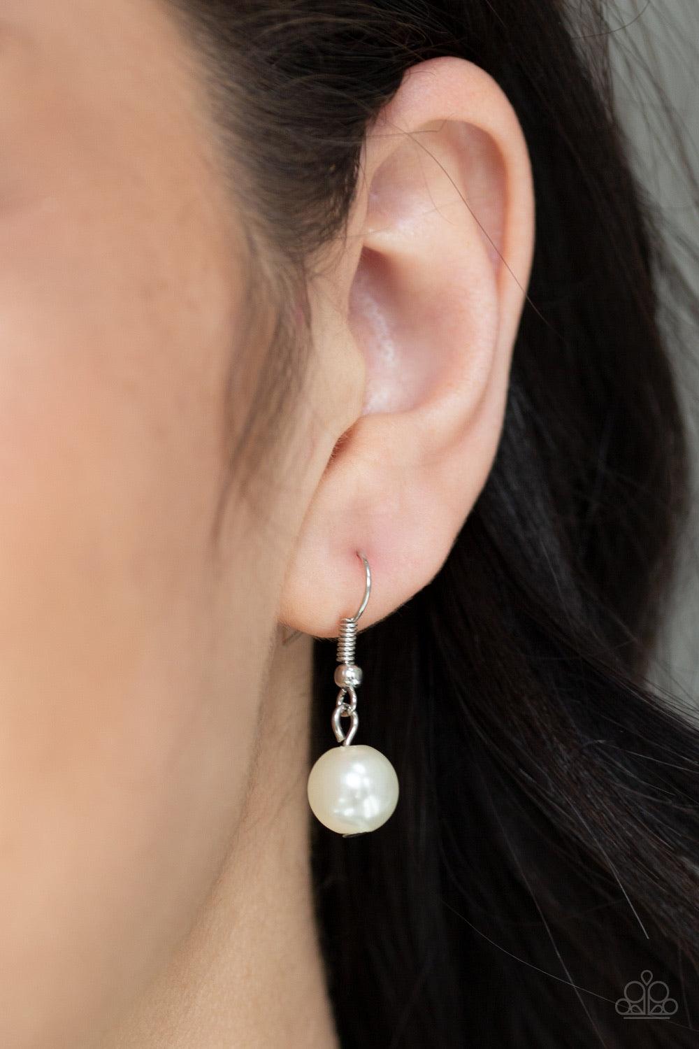 Paparazzi Accessories Woman of the Century ~White Two strands of classic white pearls are strung along invisible wires below the collar. Each strand slightly varies in size, adding a modern twist to the timeless pearl palette. Features an adjustable clasp