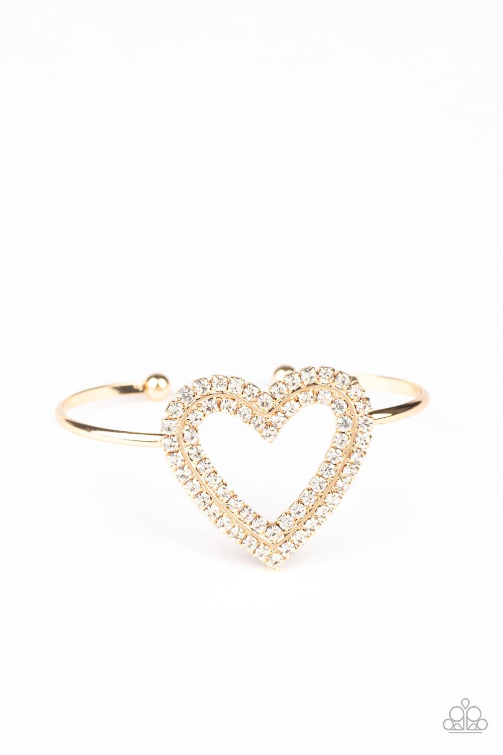 Paparazzi Accessories Heart Opener - Gold Two rows of glittery white rhinestones stack into a sparkling heart atop a dainty gold cuff for a charming look. Jewelry