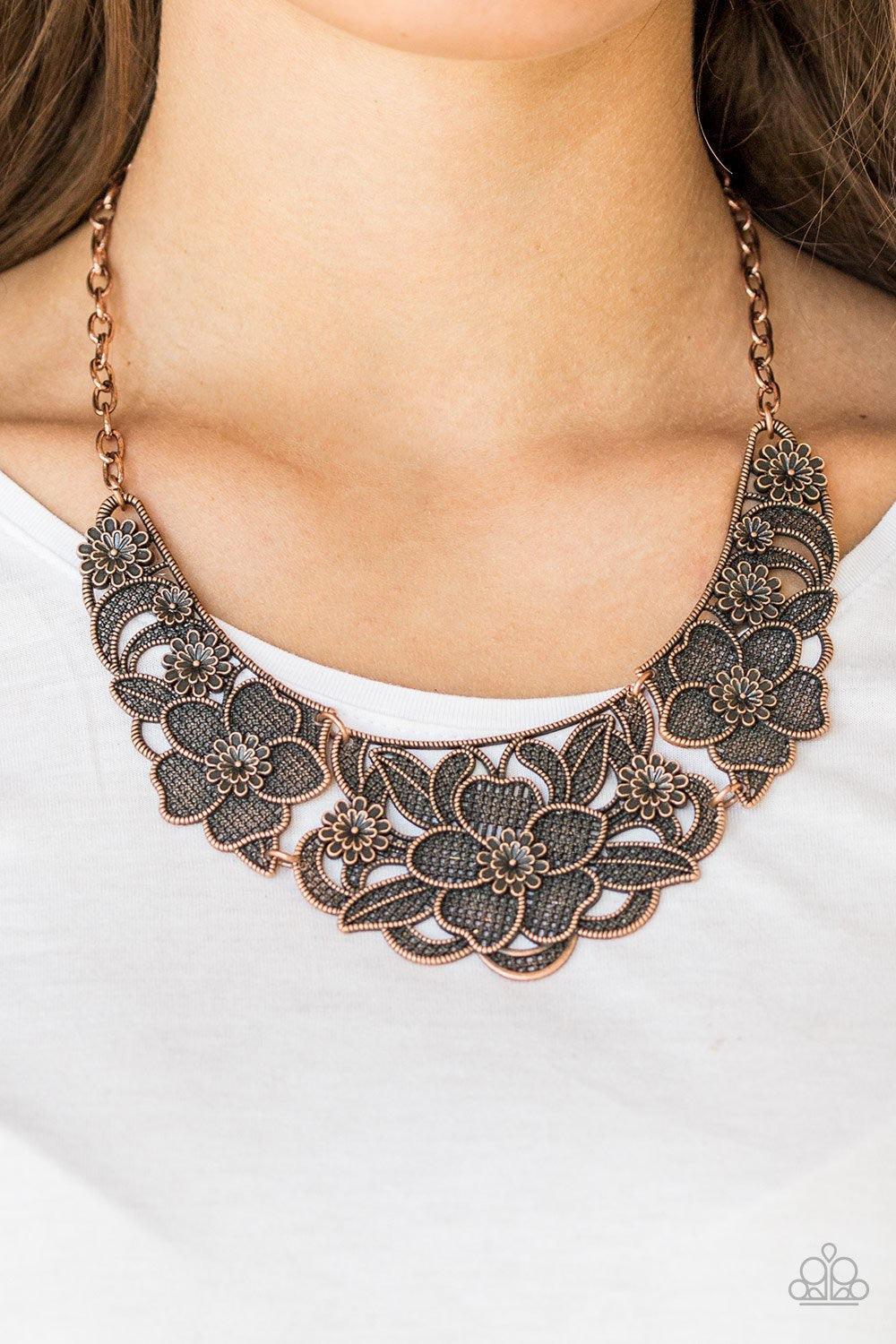 Paparazzi Accessories Petunia Paradise - Copper Featuring lattice-like patterns, shimmery copper flowers bloom below the collar for a seasonal look. Features an adjustable clasp closure. Jewelry