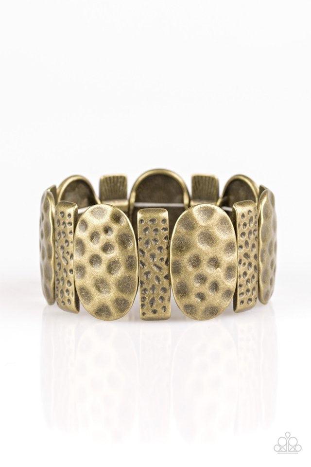 Paparazzi Accessories Cave Cache - Brass Delicately hammered in antiqued detail, round and rectangular shaped frames are threaded along stretchy bands, creating a bold tribal look around the wrist. Jewelry
