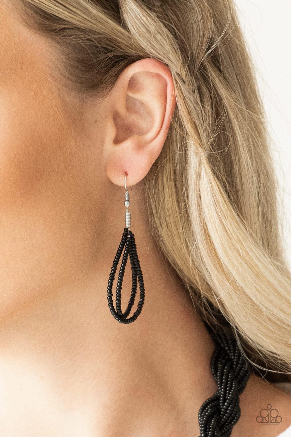 Paparazzi Accessories A Standing Ovation - Black Countless strands of black seed beads are twisted and knotted together to create an unforgettable statement piece. Features an adjustable clasp closure. Sold as one individual necklace. Includes one pair of