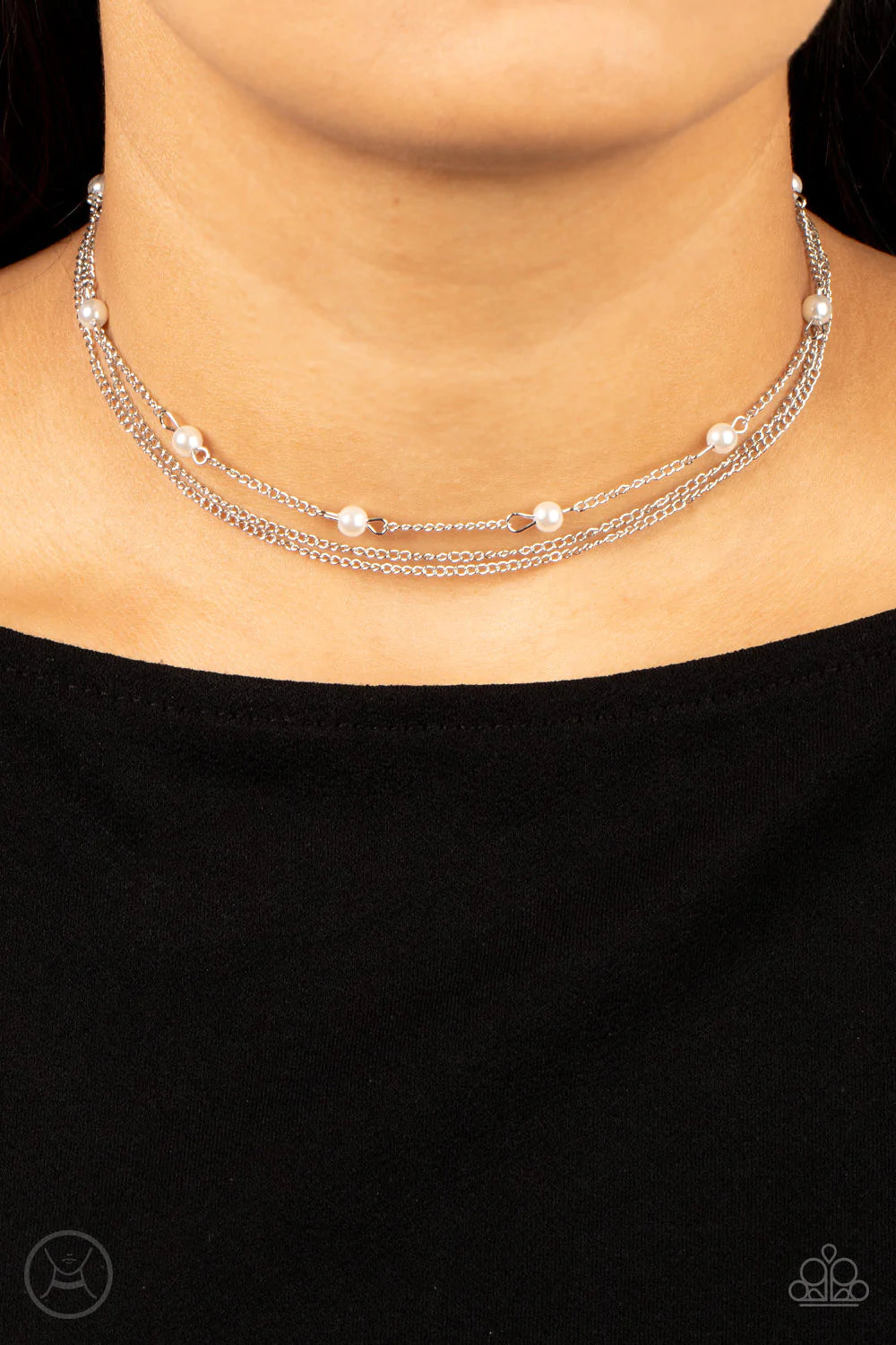 Paparazzi Accessories Daintily Dapper - White Infused with a single strand of white pearls, dainty silver chains layer around the neck for a timeless twist. Features an adjustable clasp closure. Sold as one individual choker necklace. Includes one pair of