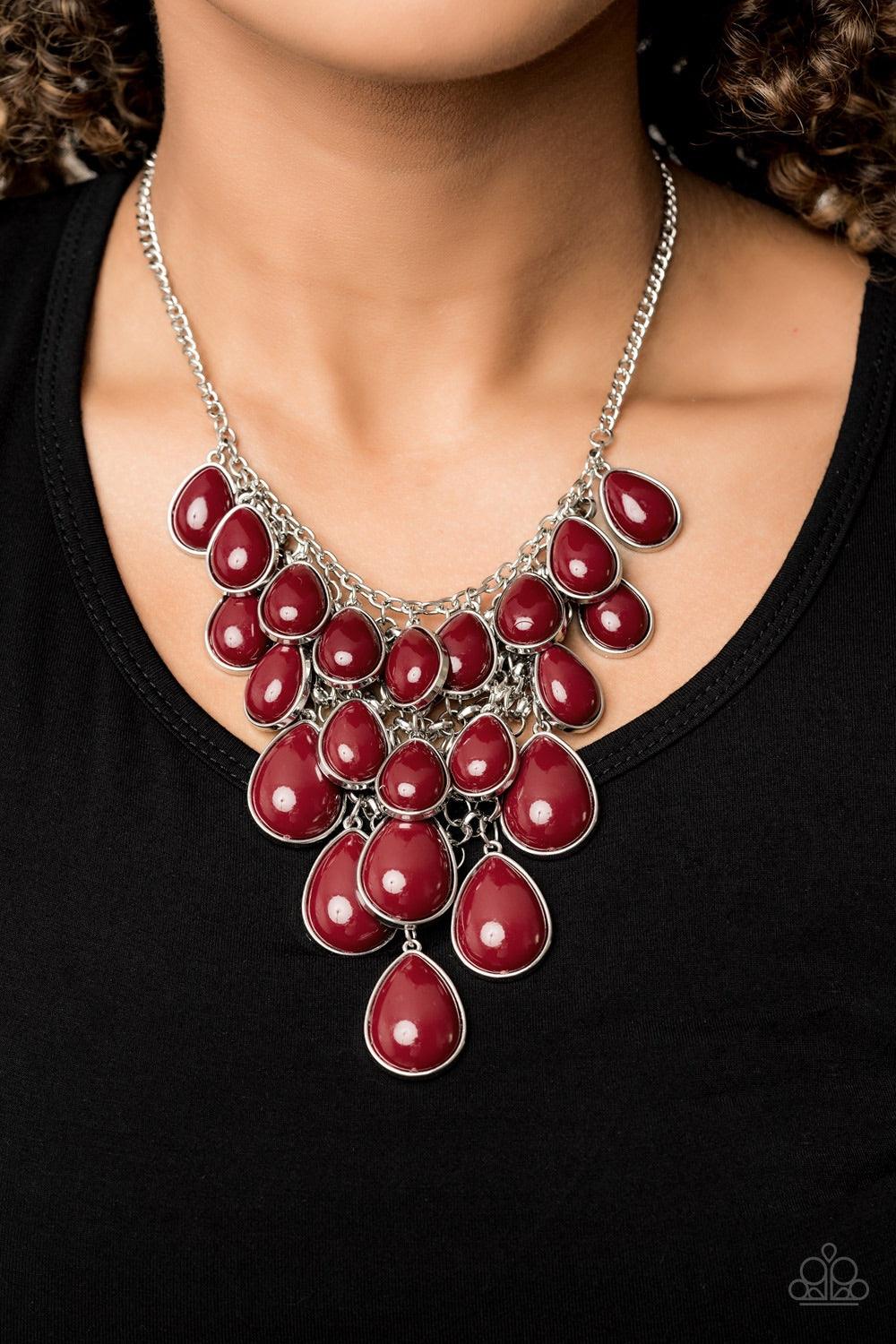 Paparazzi Accessories Shop Til You TEARDROP - Red Tinted in the classic rich hue of Wine, polished red teardrops gradually increase in size as they trickle along rows of interconnected mesh chain. The robust beads drip into a tapered shape, creating a dra