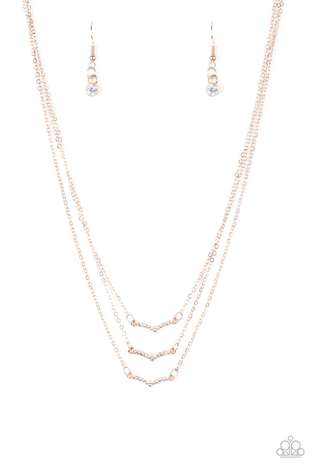 Paparazzi Accessories Pretty Petite - Rose Gold Encrusted in glassy white rhinestones, three dainty rose gold frames layer below the collar for a classic look. Features an adjustable clasp closure. Sold as one individual necklace. Includes one pair of mat