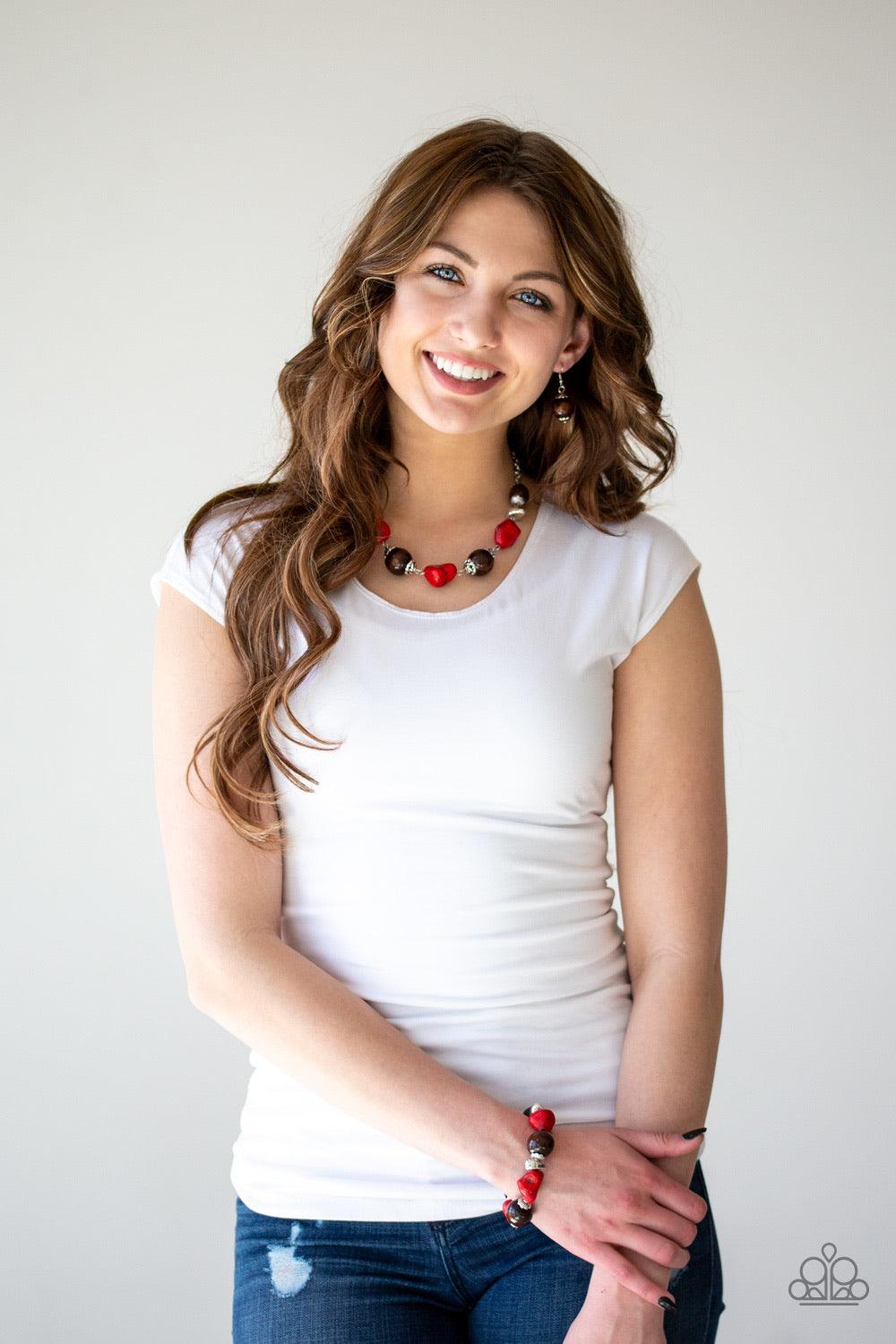 Paparazzi Accessories Earth Goddess - Red Infused with ornate silver accents, red stones and round wooden beads trickle along a shimmering silver chain, creating an artisanal statement piece that falls just below the collar. Features an adjustable clasp c