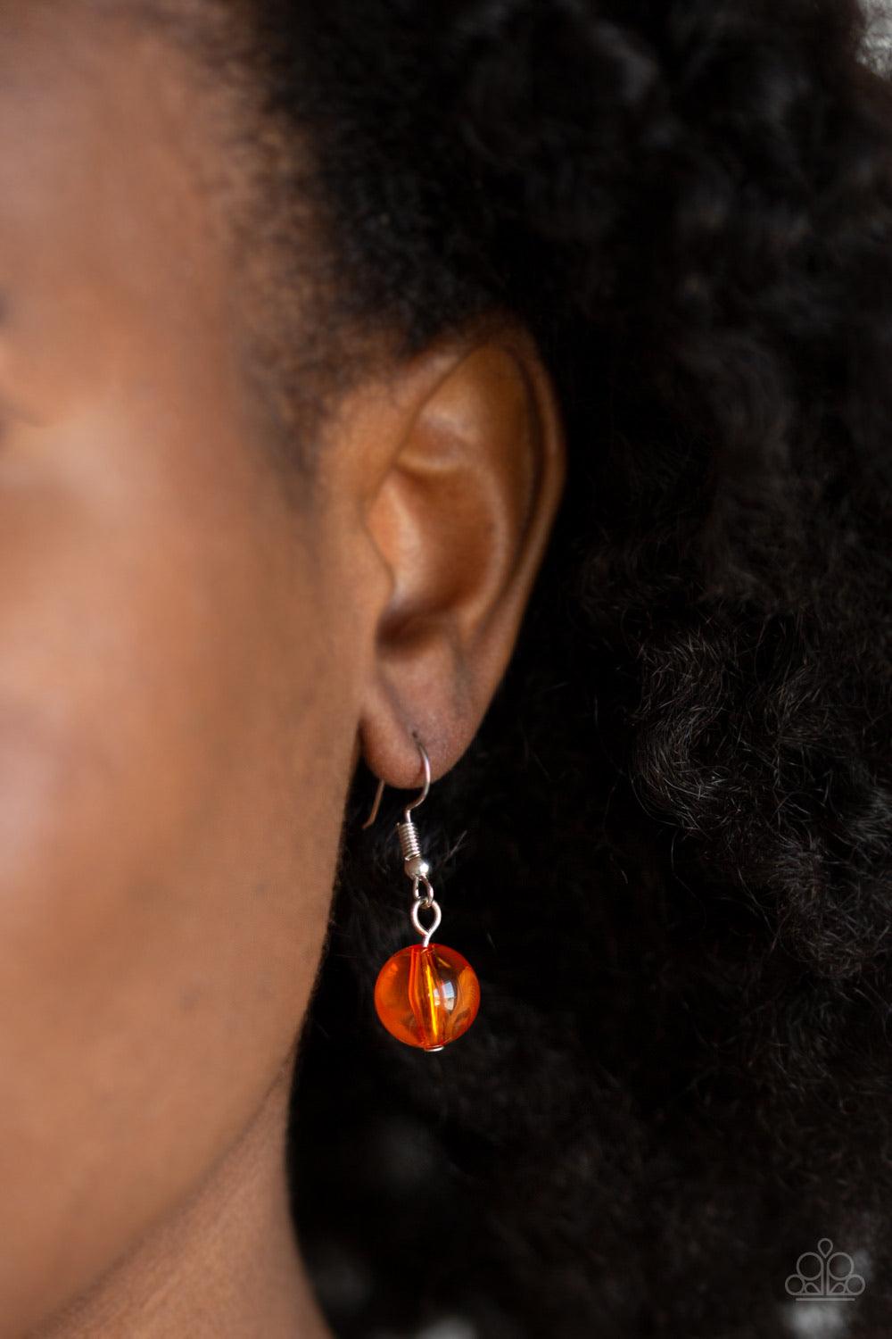 Paparazzi Accessories Beach Glam - Orange Varying in shape and opacity, a refreshing collection of glassy and iridescent Amberglow beads layer below the collar for a boldly colorful look. Features an adjustable clasp closure. Sold as one individual neckla