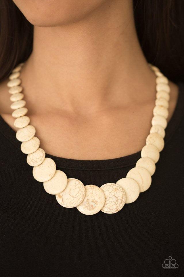 Paparazzi Accessories Sierra Mountains - White Gradually increasing in size, flat white stones are threaded along a white thread, stacking below the collar for a refreshing artisanal look. Features an adjustable clasp closure. Sold as one individual neckl