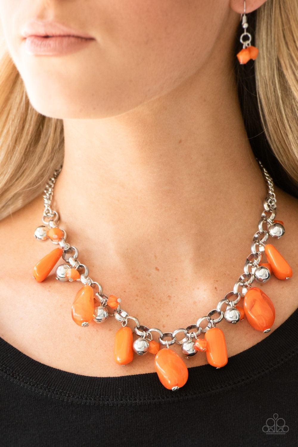 Paparazzi Accessories Grand Canyon Grotto - Orange Featuring polished and cloudy finishes, a collection of Turmeric faux rocks dance from the bottom of a bold silver chain. Classic silver beads trickle between the colorful beading, adding a metallic shimm