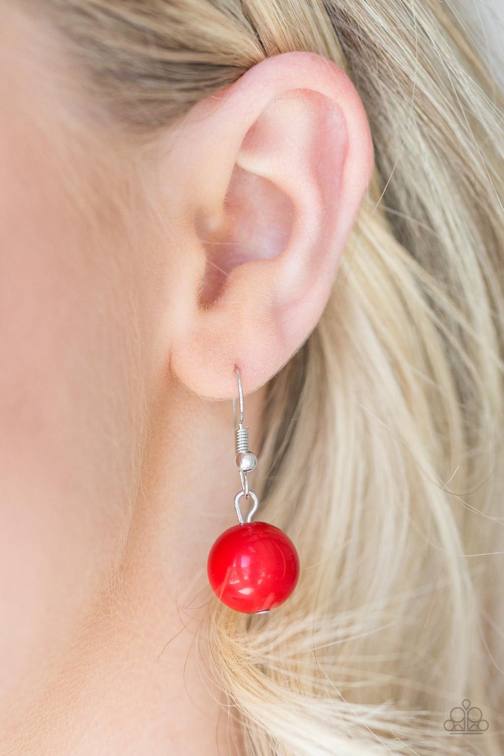 Paparazzi Accessories South Shore Sensation - Red Dramatic silver, fiery red, and faceted cloudy beads are threaded along an invisible wire below the collar for a seasonal look. Features an adjustable clasp closure. Jewelry