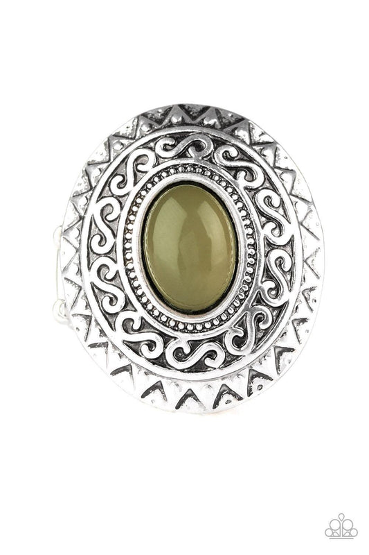 Paparazzi Accessories Hello, Sunshine - Green A glowing green stone is pressed in the center of a dramatic silver frame radiating with shimmery sunburst details for a seasonal look. Features a stretchy band for a flexible fit. Sold as one individual ring.