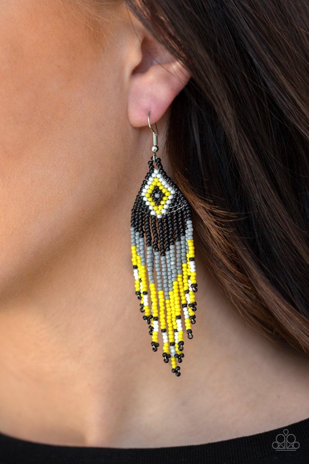 Paparazzi Accessories Wind-Blown Wanderer ~Multi Strands of black, gray, white, and yellow seed beads cascade from the bottom of a southwestern beaded pattern, creating a vivacious beaded fringe. Earring attaches to a standard fishhook fitting.
