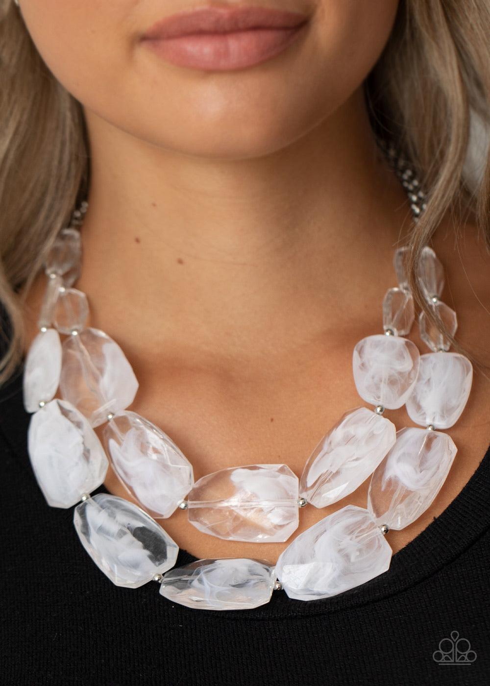 Paparazzi Accessories Gives Me Chills - White Varying in shape and size, opaque and glassy crystal-like beads delicately link into two icy layers below the collar for a stunning statement-making finish. Features an adjustable clasp closure. Sold as one in