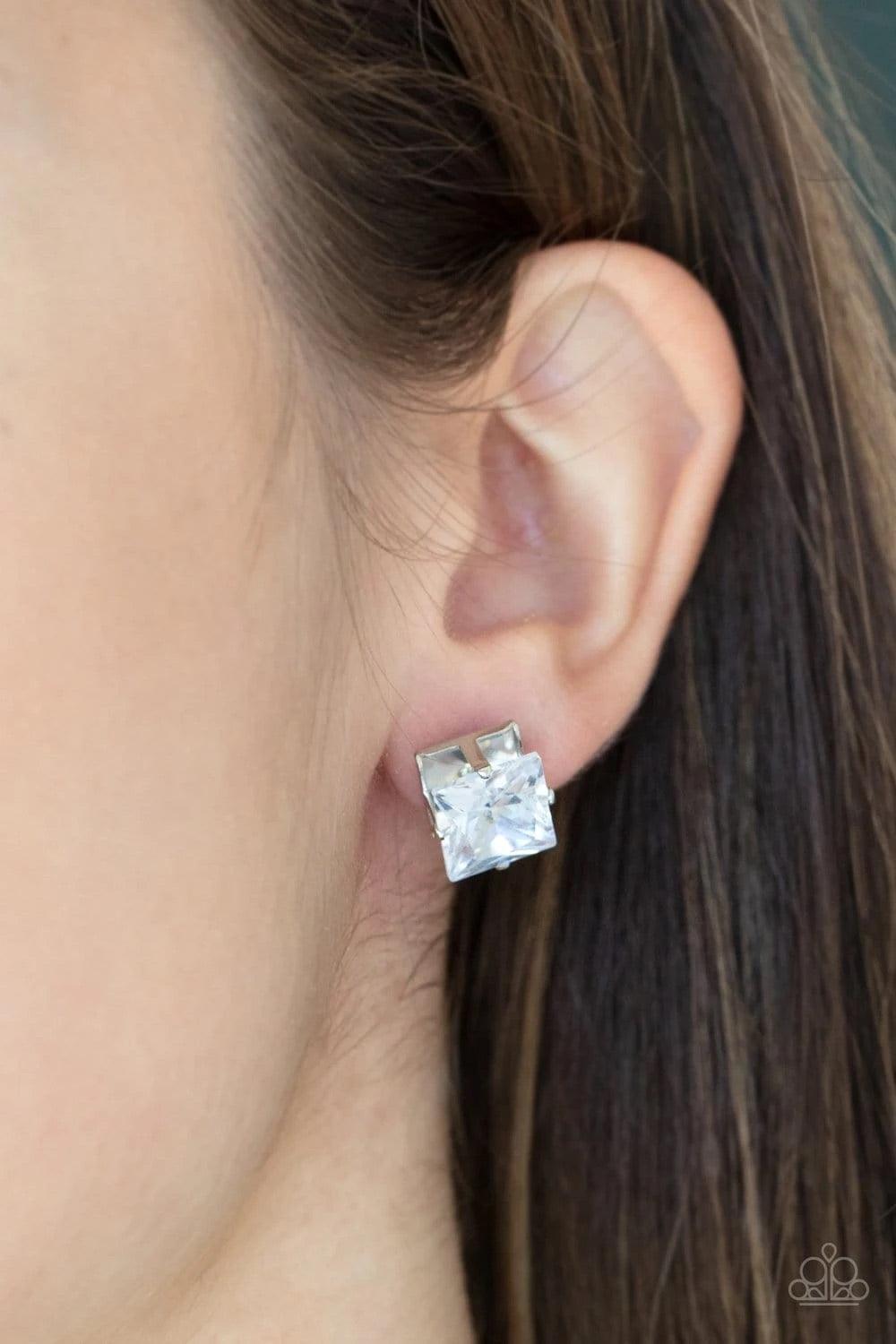 Paparazzi Accessories Times Square Timeless - White A stunning oversized square rhinestone, set in a classic silver pronged fitting, makes a show-stopping impact as it shines brilliantly and draws attention up to the face. Earring attaches to a standard p