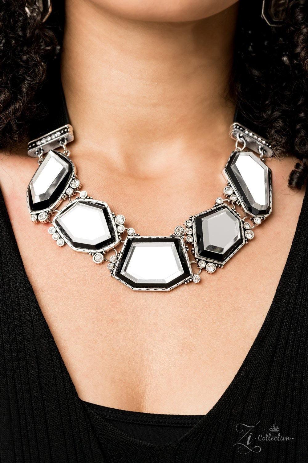 Paparazzi Accessories Rivalry 💗ZiCollection $25💗 Two thick strips of black leather give way to a blinding collection of glassy geometric gems, creating a mirror-like fringe below the collar. Varying in shape, the blinding gems are pressed into hammered