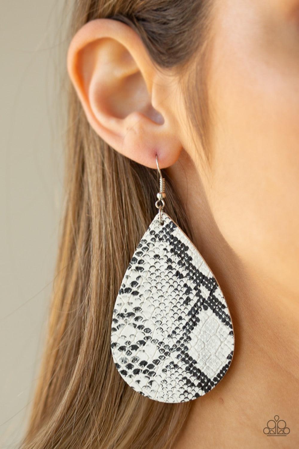 Paparazzi Accessories Hiss, Hiss - White Featuring a white python print, a shiny leather teardrop frame swings from the ear for a wildly wonderful look. Earring attaches to a standard fishhook fitting. Jewelry