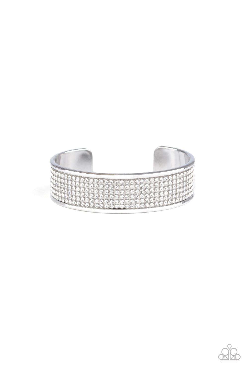 Paparazzi Accessories Can’t Believe Your ICE - White Row after row of white rhinestones are encrusted along the front of a thick silver cuff, creating a blinding statement piece around the wrist. Sold as one individual bracelet. This piece was featured as