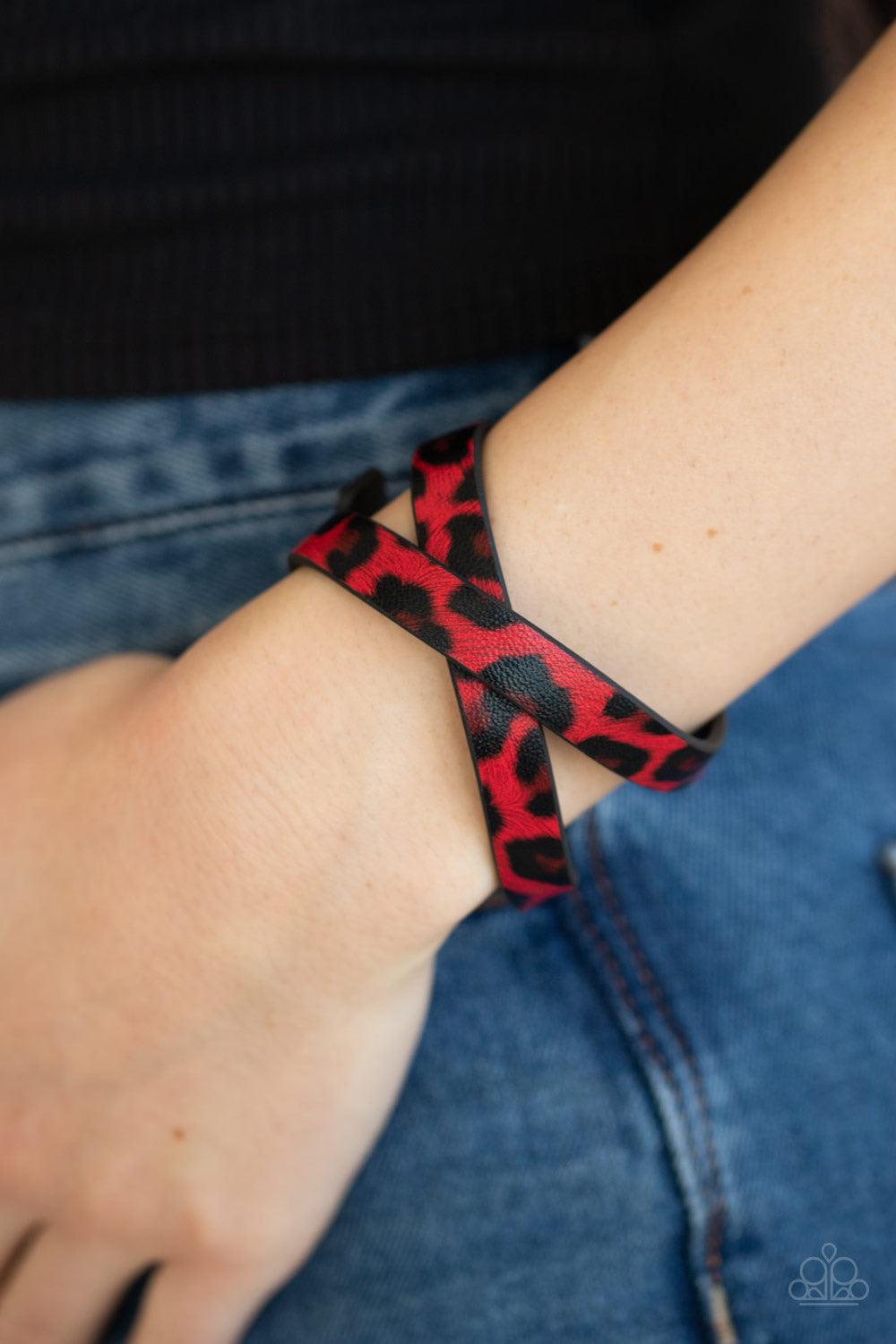 Paparazzi Accessories All GRRRirl - Red Featuring a red and black cheetah pattern, a strip of black leather double wraps around the wrist for a wild look. Features an adjustable snap closure. Jewelry