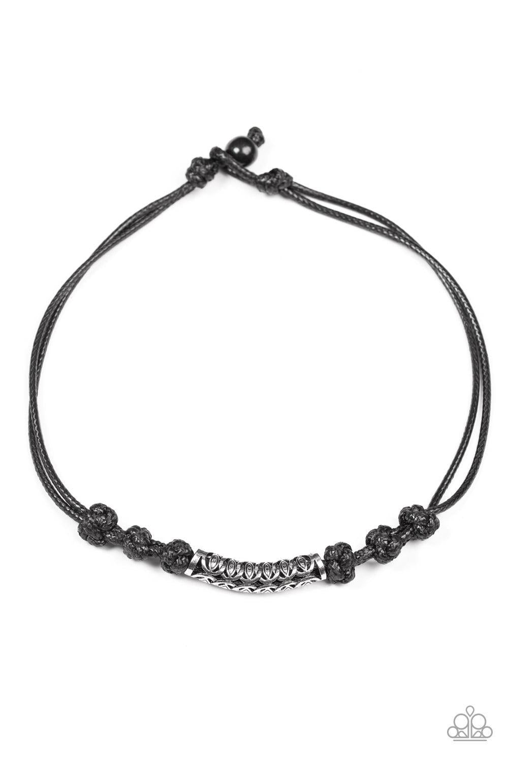 Paparazzi Accessories Jungle Rover - Black An ornate silver bead is knotted in place along strands of shiny black cording, creating an urban look below the collar. Features an adjustable button loop closure. Jewelry