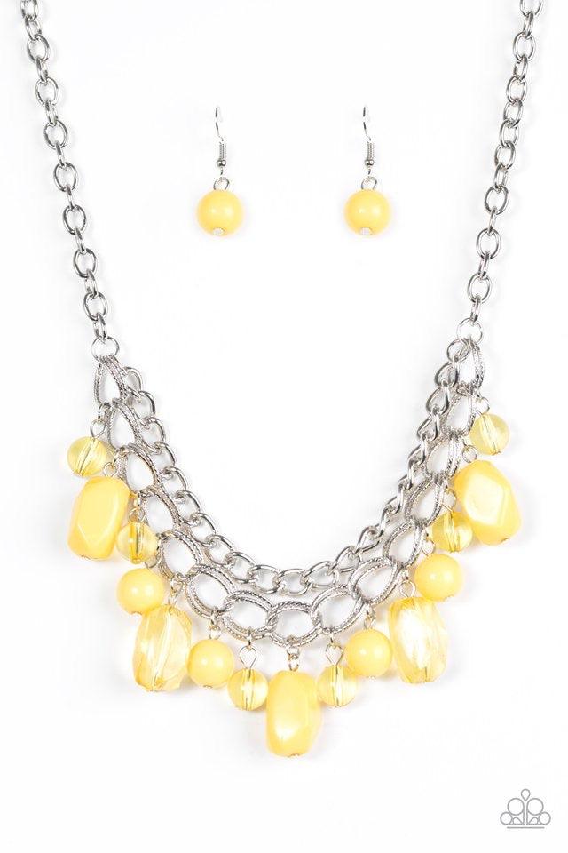 Paparazzi Accessories Brazilian Bay - Yellow Featuring glassy and polished finishes, round and asymmetrical yellow beads trickle from the bottom of a double-linked silver chain. An additional silver chain is layered above the summery beading for a seasona