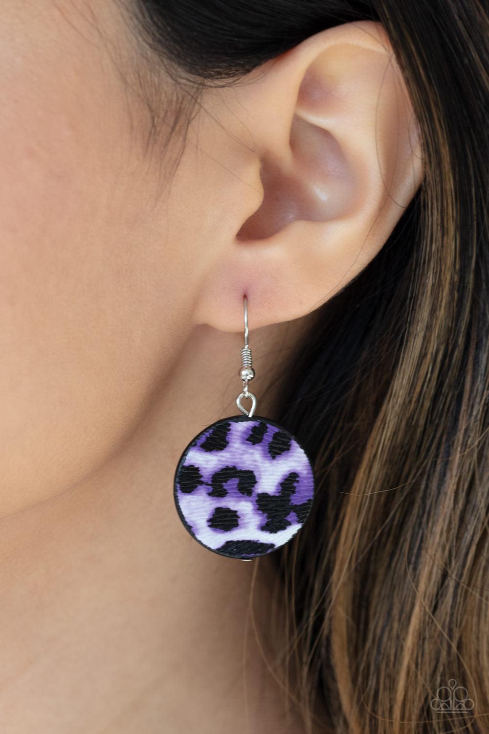 Paparazzi Accessories Here Kitty Kitty - Purple Featuring textured purple cheetah print, a wild collection of circle and square leather pieces are threaded along an invisible wire below the look for a fierce look. Features an adjustable clasp closure. Sol