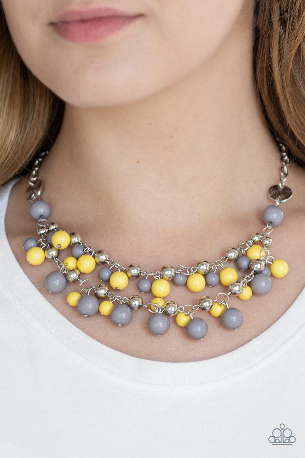 Paparazzi Accessories Seaside Soirée - Multi Hammered silver discs give way to layers of gray, yellow, and shiny silver beads. The colorful collection layers below the collar, creating a bubbly fringe. Features an adjustable clasp closure. Sold as one ind