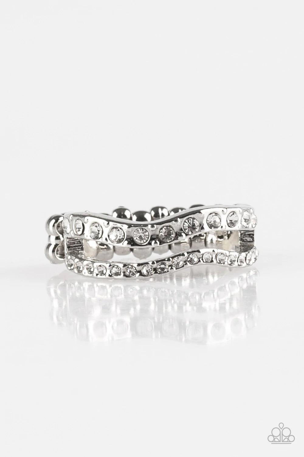 Paparazzi Accessories Elite Squad - White Varying in size, glittery white rhinestones are encrusted along waving silver bands for a refined look. Features a dainty stretchy band for a flexible fit. Rings