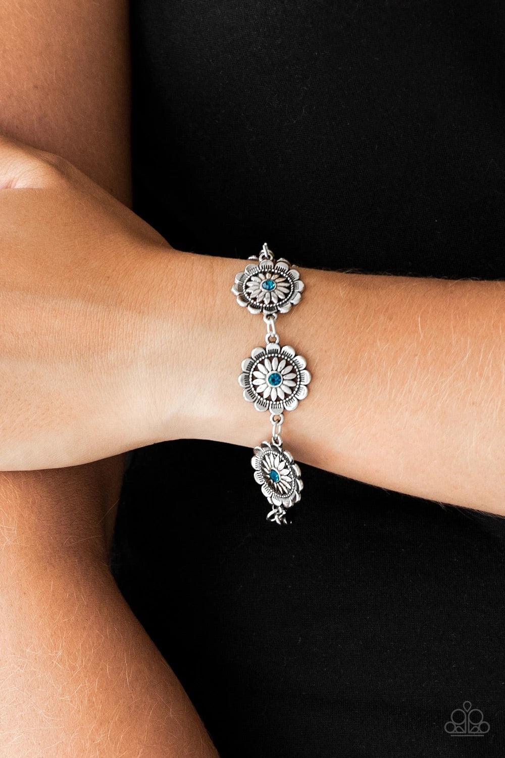 Paparazzi Accessories Funky Flower Child - Blue Dotted with blue rhinestone centers, ornate silver floral frames link across the wrist for a seasonal look. Features an adjustable clasp closure. Sold as one individual bracelet. Jewelry