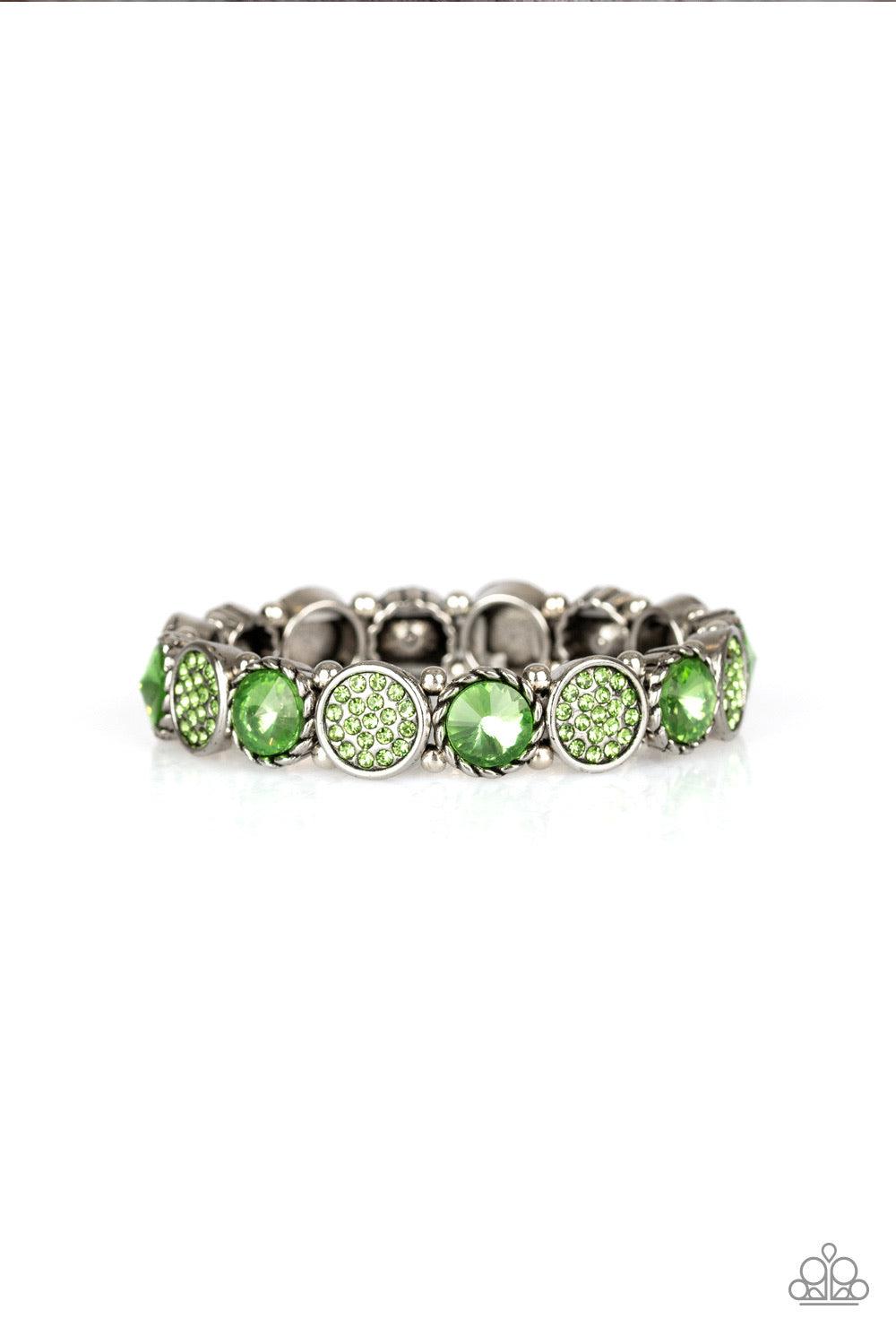 Paparazzi Accessories Take A Moment to Reflect - Green Featuring an array of glittery green rhinestones, mismatched silver frames and dainty silver beads are threaded along stretchy bands around the wrist for a glamorous flair. Jewelry