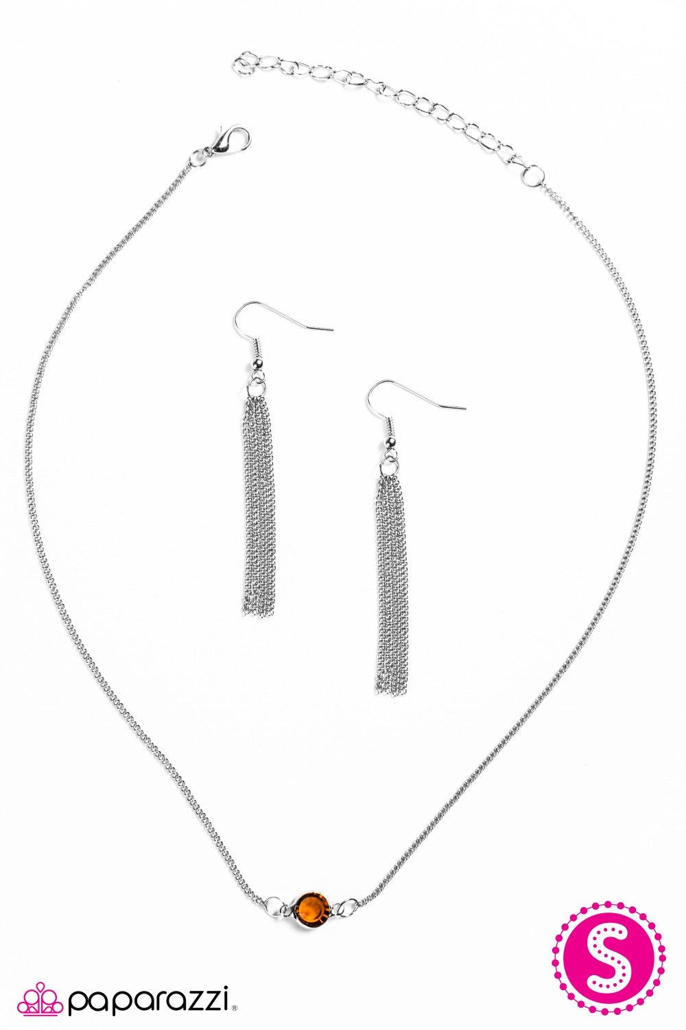 Paparazzi Accessories Stay Glassy -Brown A sparkling brown gem is nestled inside a classic silver frame, creating a simple, yet colorful pendant. Features an adjustable clasp closure. Necklaces