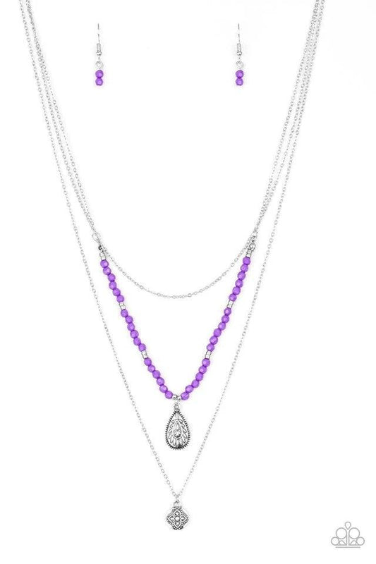 Paparazzi Accessories Mild Wild - Purple Infused with vivacious purple beading and an ornate silver teardrop pendant, a colorfully beaded strand gives way to a plain silver chain and a dainty silver chain featuring an antiqued pendant for a whimsically la