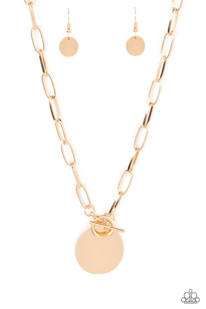 Paparazzi Accessories Tag Out - Gold An oversized oval gold disc swings from the bottom of a substantial oval linked gold chain, resulting in a gritty industrial pendant below the collar. Features a toggle closure. Sold as one individual necklace. Include