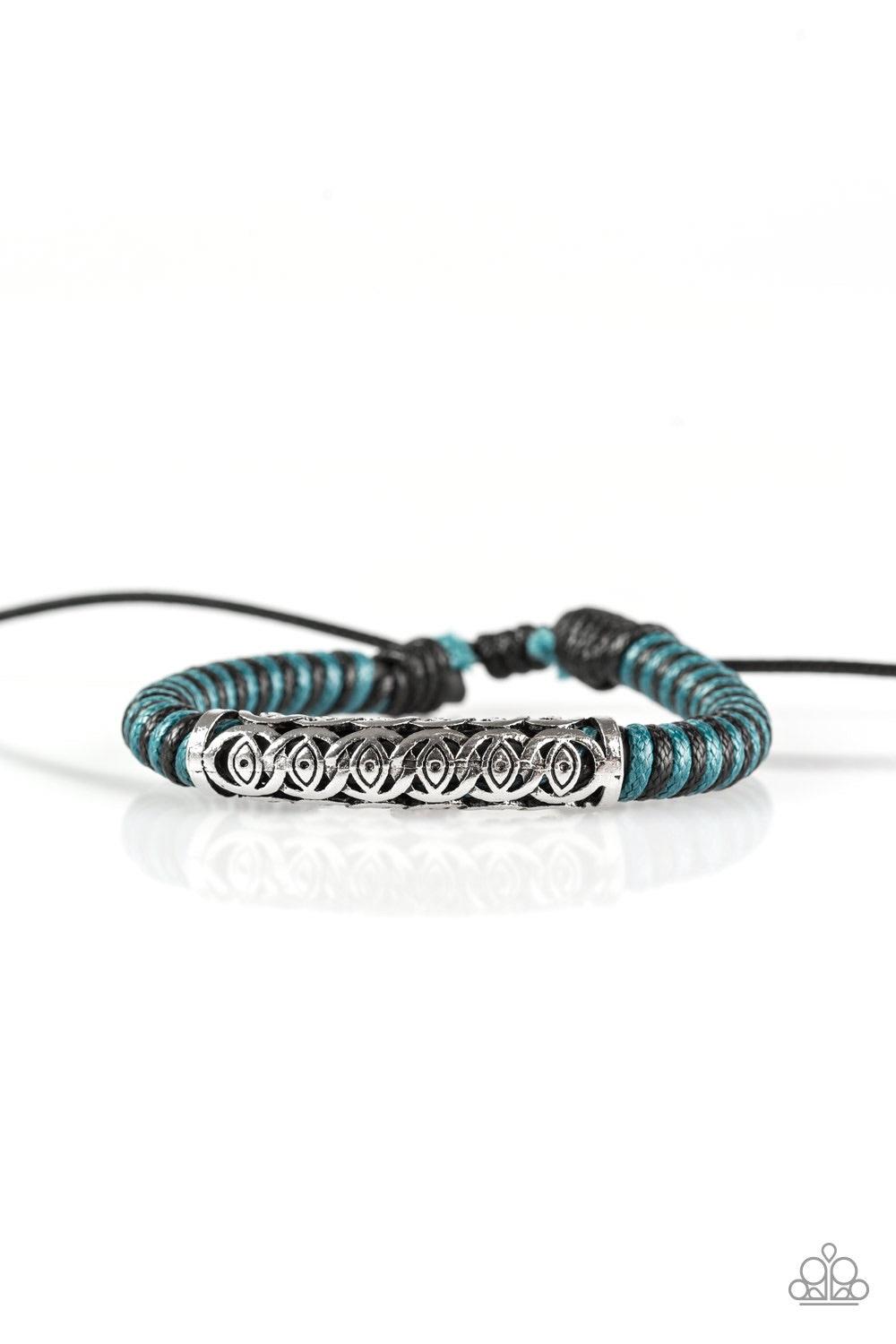 Paparazzi Accessories Island Escape - Blue Blue and black cording knots around a leather cord, creating a colorful urban piece around the wrist. An ornate silver bead slides along the colorful strand, creating a bold centerpiece. Features an adjustable sl