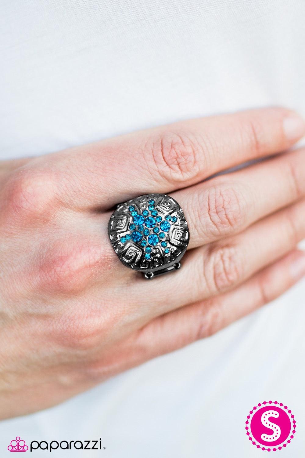 Paparazzi Accessories Have A Blast - Blue A glistening gunmetal frame is etched in indigenous inspired patterns. An explosion of glittery blue rhinestones radiate from the center for a blast of color. Jewelry