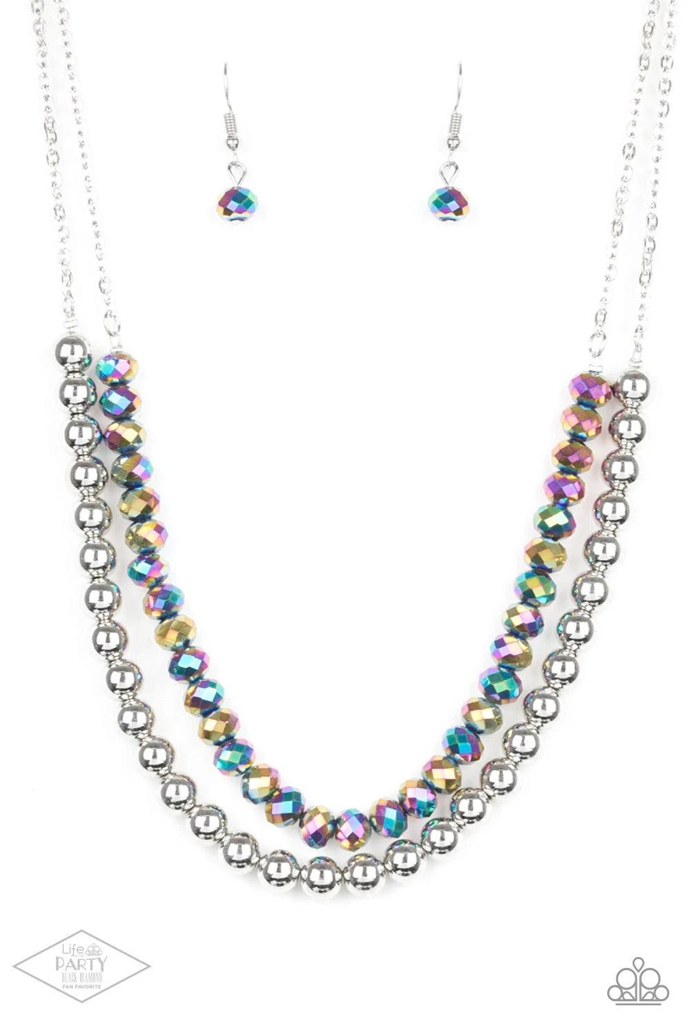 Paparazzi Accessories Color of the Day - Multi Dipped in a rainbow iridescence, a strand of metallic crystal-like beads gives way to a strand of shiny silver beads below the collar for a colorfully layered look. Features an adjustable clasp closure. Sold