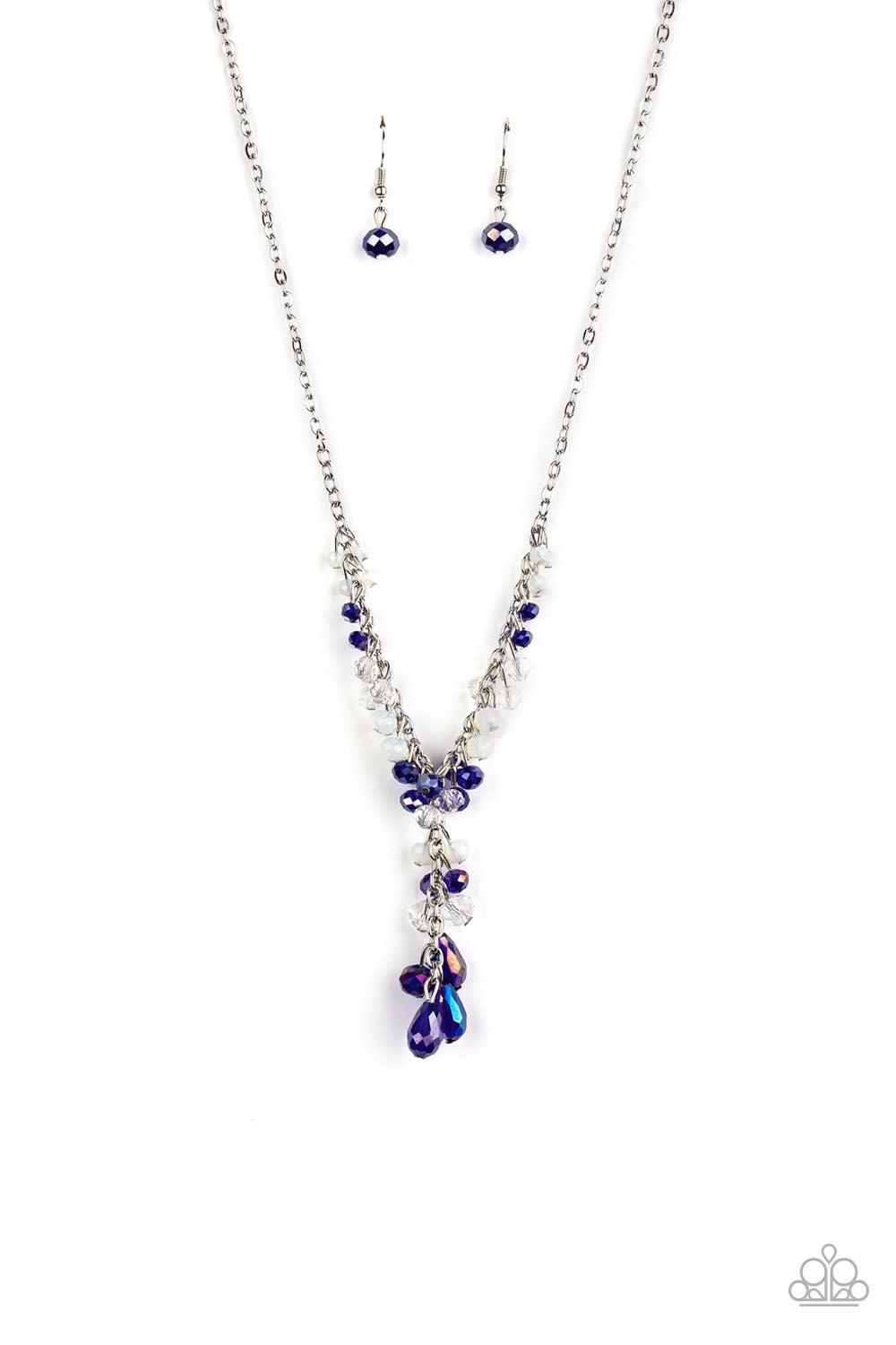 Paparazzi Accessories Iridescent Illumination - Blue A fringe of white, opaque, and iridescent blue crystal-like beads dangle from the bottom of a shimmery silver chain. Matching round and teardrop beads cascade from an extended silver chain at the center