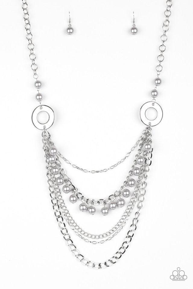 Paparazzi Accessories BELLES and Whistles - Silver Dramatic silver hoops give way to layers of mismatched silver chains. Pearly silver beads trickle from the second chain, creating a flirty fringe across the chest. Features an adjustable clasp closure. So
