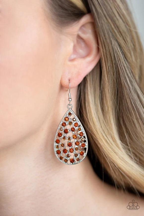 Paparazzi Accessories Call Me Ms. Universe - Brown Hints of silver and glittery rhinestones collect inside an airy silver teardrop frame, creating a gorgeous lure. Earring attaches to a standard fishhook fitting. Jewelry