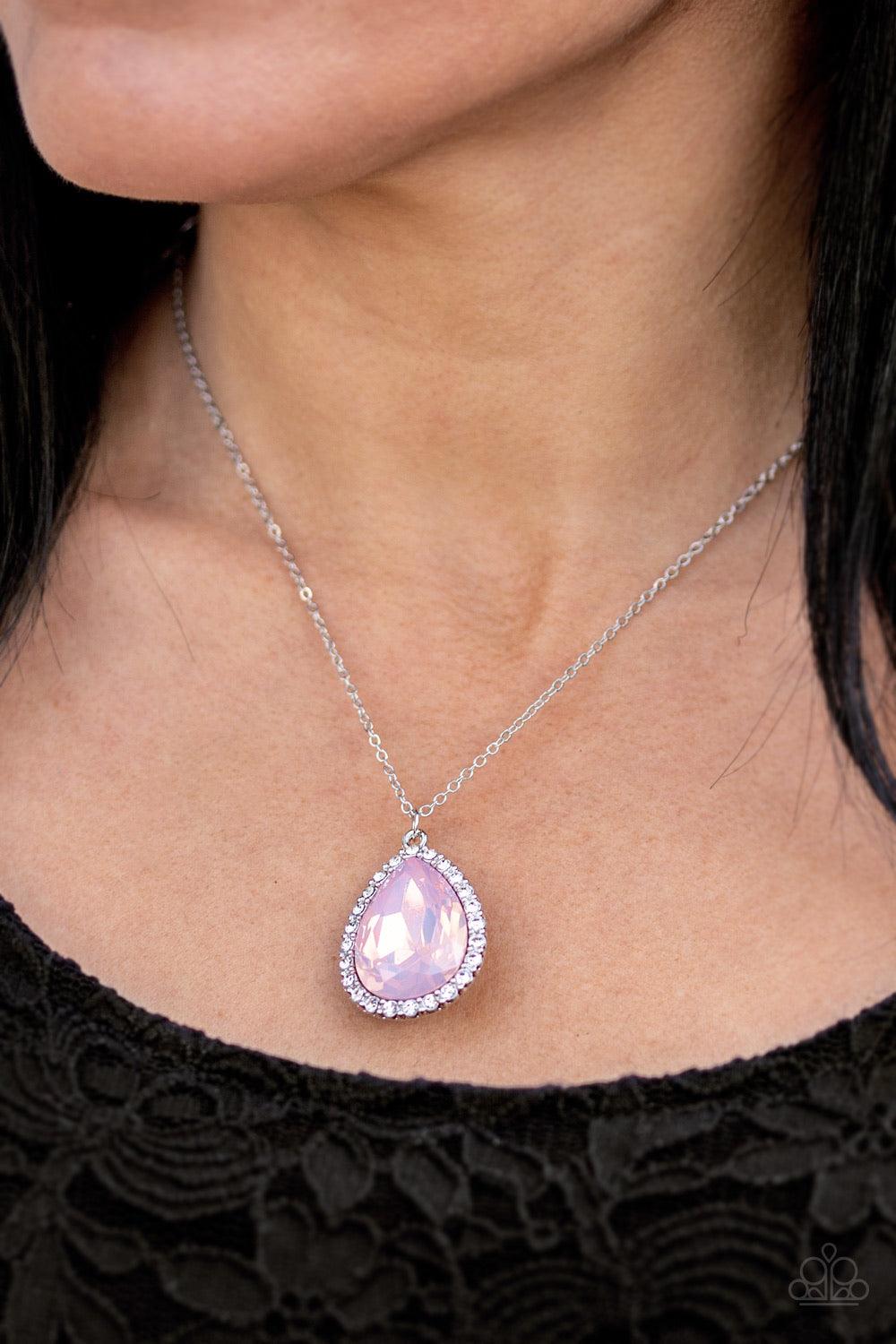 Paparazzi Accessories Come of AGELESS - Pink A teardrop pink stone is pressed into a silver frame surrounded by white rhinestones, creating a tranquil pendant below the collar. Features an adjustable clasp closure. Sold as one individual necklace. Include